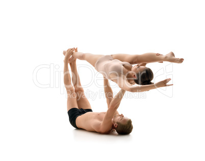 Acrobats train in pair. Isolated on white