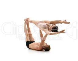 Acrobats train in pair. Isolated on white