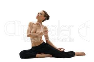 Topless woman engaged in yoga. Isolated on white