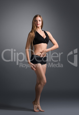 Fitness. Attractive caucasian girl poses at camera