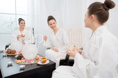 Tea drinking in spa salon. Photo of lovely ladies