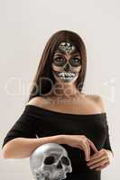 Glamorous Sugar skull girl posing at camera