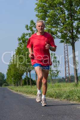 Senior runner while training for a competition