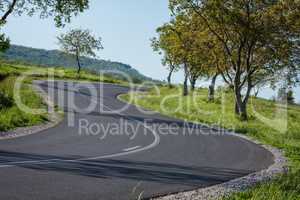 Straight asphalt road leading into the distance