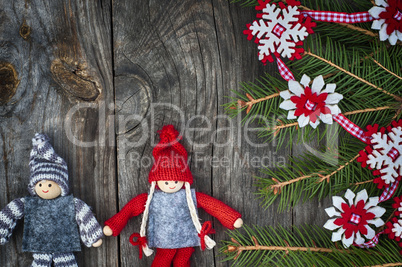 Christmas background with decorated fir branch and textile toys