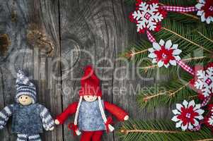 Christmas background with decorated fir branch and textile toys
