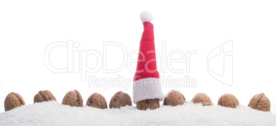 Christmas background with walnuts in snow