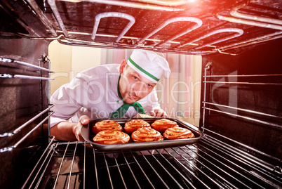 Chef cooking in the oven.