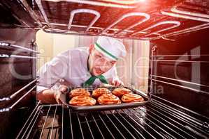 Chef cooking in the oven.