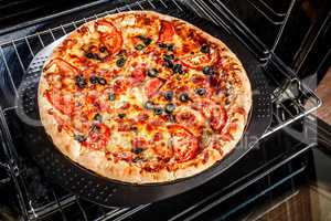 Appetizing pizza in the oven.