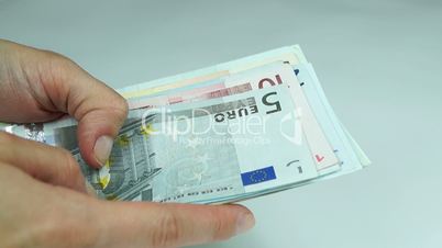 Women counts euro banknotes