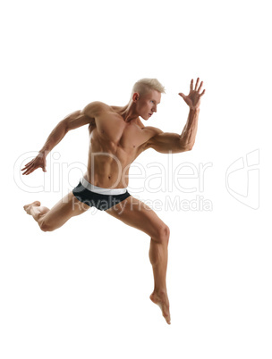 Blond athlete poses during jump. Isolated on white