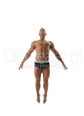 Studio photo of blond man while he jumping