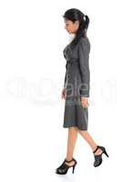 Side view Indian business woman walking