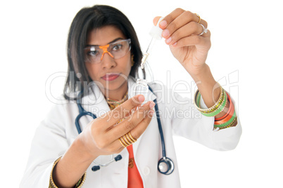 Female medical doctor with test sample