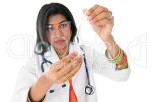 Female medical doctor with test sample