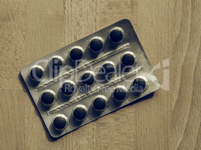 Vintage looking Medical pills on a table