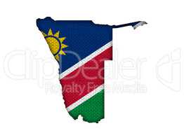 Karte und Fahne von Namibia auf altem Leinen