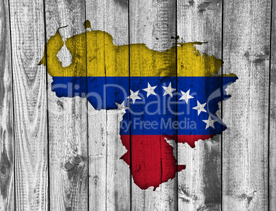 Karte und Fahne von Venezuela auf verwittertem Holz
