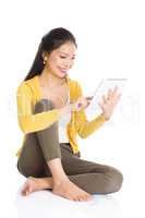 Young Asian girl using tablet pc