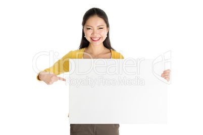 Young Asian woman holding white paper card