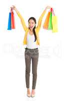 Happy Asian girl with shopping bags