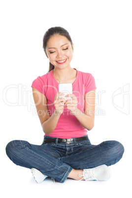 Young Asian college student using smartphone