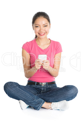 Young Asian university student using smartphone