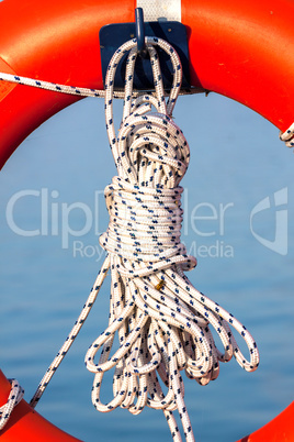Orange life buoy with rope