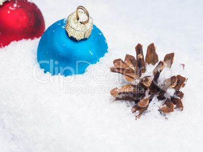Christmas baubles in snow