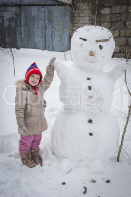 happy girl and snowman