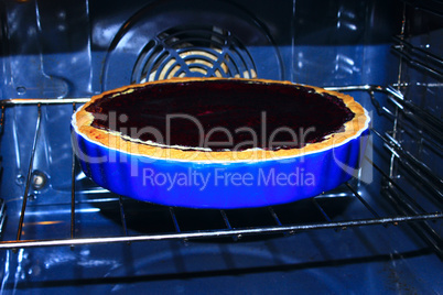blueberry pie is cooked in the oven