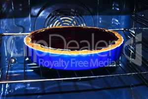blueberry pie is cooked in the oven