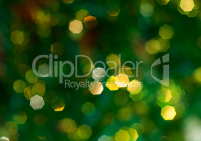 Green background with yellow bokeh, blurred background