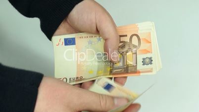 Man counts euro banknotes