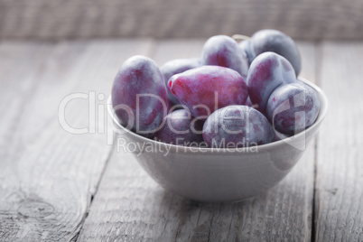 Bunch of Plums on a wooden table