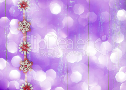 blurred purple background with Christmas garland, empty space on