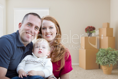Young Military Family in Empty Room with Packed Boxes