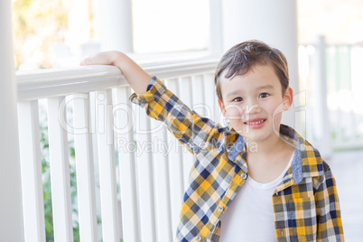 Young Mixed Race Boy on His Front Porch