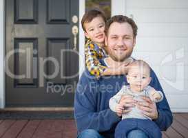 Mixed Race Father and Sons on Front Porch