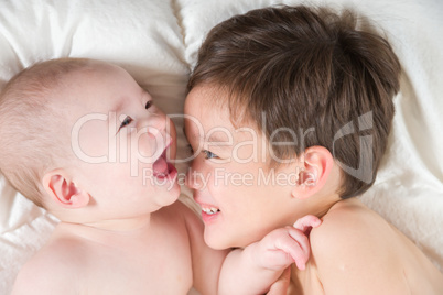 Mixed Race Chinese and Caucasian Baby Brothers Having Fun Laying