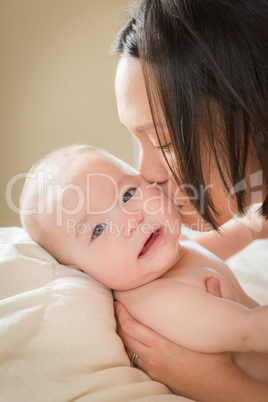 Mixed Race Chinese and Caucasian Baby Boy Laying In Bed with His