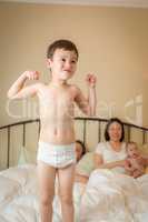 Mixed Race Chinese and Caucasian Boy Jumping In Bed with His Fam