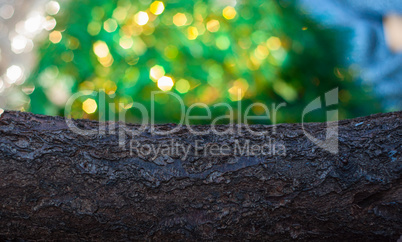 wood beam and blurred green background with bright bokeh