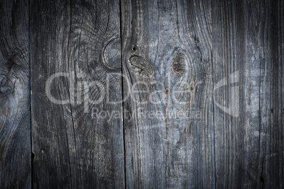 Gray old wooden background with knots and cracks