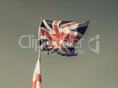 Vintage looking Flag of UK over blue sky