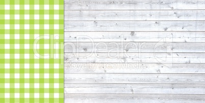 Helle Holzbretter mit Tischdecke grün weiß