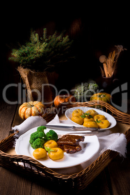 dumplings with pumpkin puree and grilled ribs