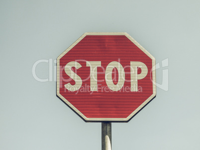 Vintage looking Stop sign over blue sky