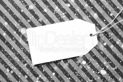 Label On Black Wrapping Paper With Copy Space And Snowflakes